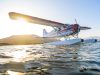 DeHavilland Beaver on floats with glowing sun